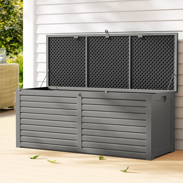 Gray outdoor storage box with a lattice design on a wooden deck.