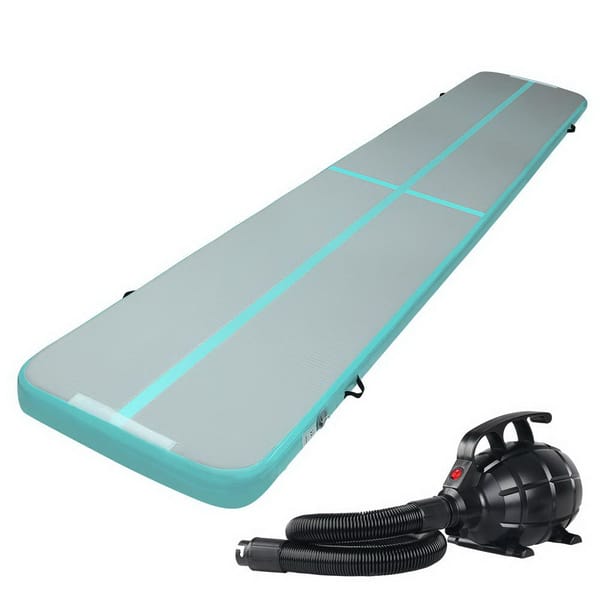 Inflatable air track with pump on a white background