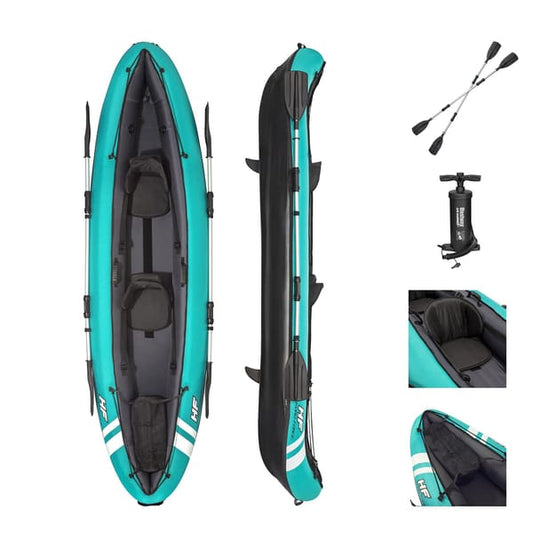 Teal inflatable kayak with black interior, two paddles, and a pump on a white background